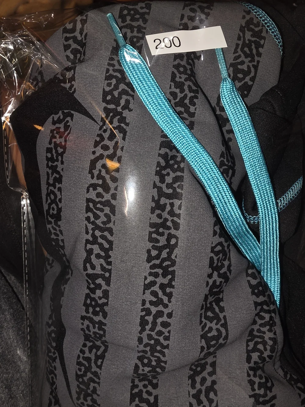 Nike Black Hoodie with Teal Accents and Striped Front
